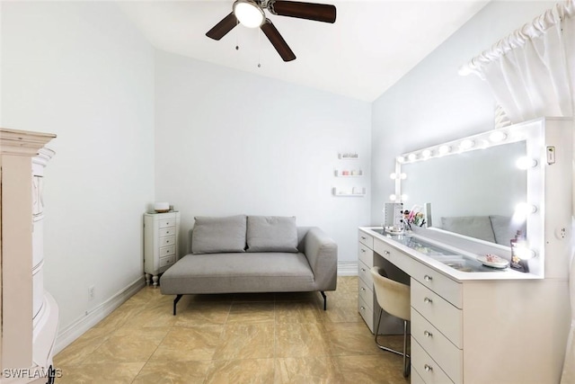 interior space featuring ceiling fan and baseboards