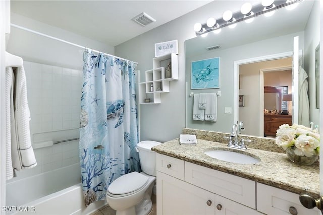 bathroom featuring toilet, shower / tub combo, vanity, and visible vents