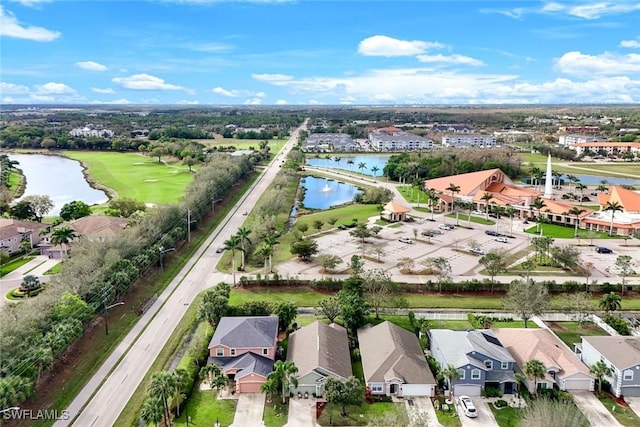 birds eye view of property with a water view and a residential view