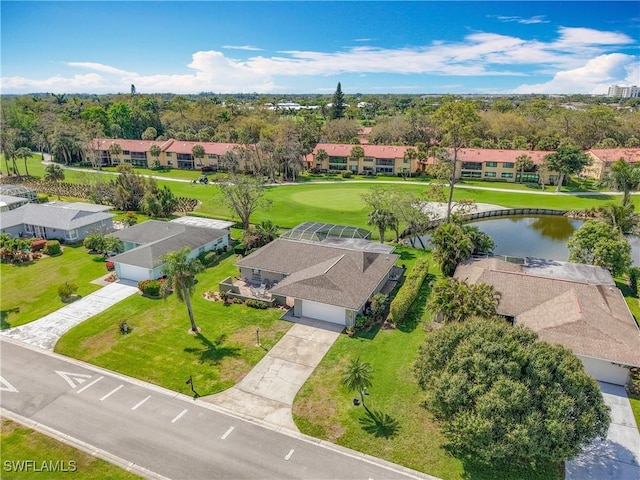 drone / aerial view with a water view and a residential view