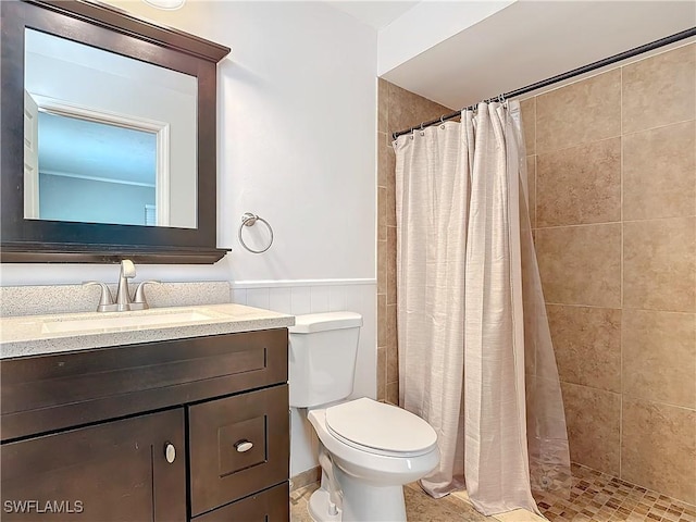 4364 Beechwood Lake Dr, Naples, FL 34112 - full bath with wainscoting, vanity, toilet, and tiled shower