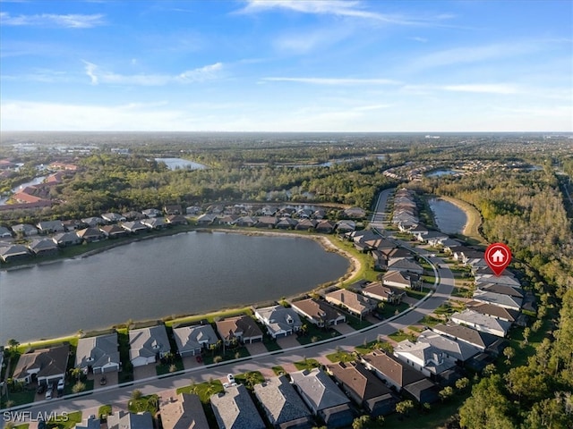 drone / aerial view featuring a residential view and a water view