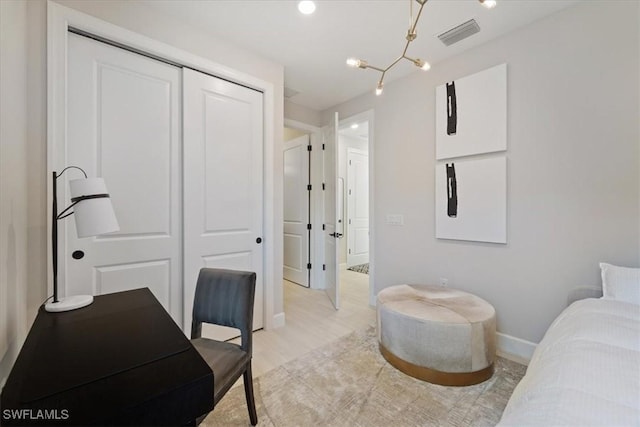 home office featuring visible vents, baseboards, and light wood-style flooring