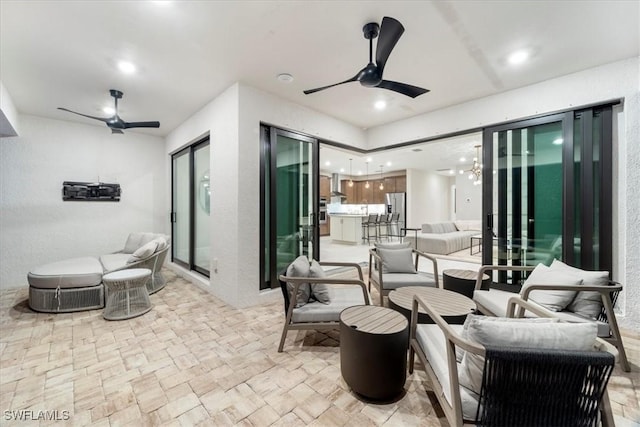 view of patio / terrace featuring an outdoor living space and a ceiling fan