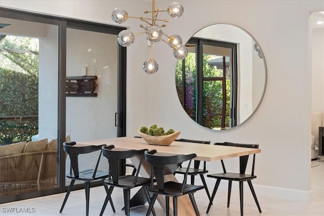 dining area with baseboards and plenty of natural light