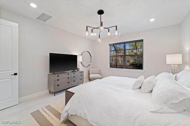 bedroom featuring visible vents, recessed lighting, an inviting chandelier, light wood finished floors, and baseboards