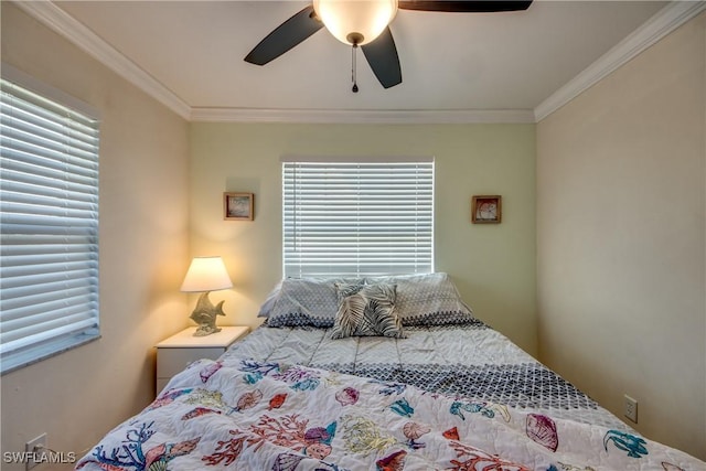 bedroom with multiple windows, crown molding, and ceiling fan