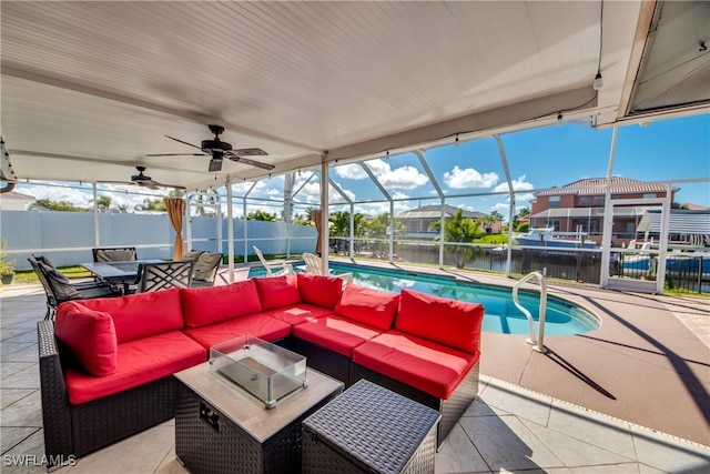 view of patio featuring a fenced in pool, a ceiling fan, an outdoor hangout area, a lanai, and fence