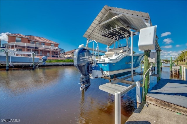 view of dock with a water view and boat lift