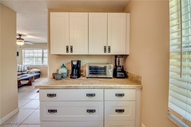 kitchen featuring white cabinets and a toaster