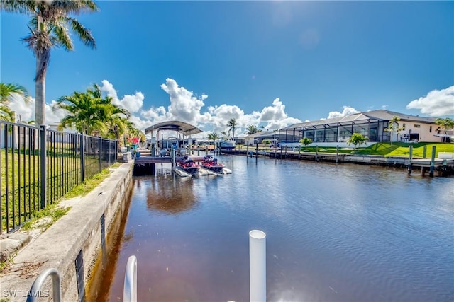 property view of water featuring a boat dock and fence