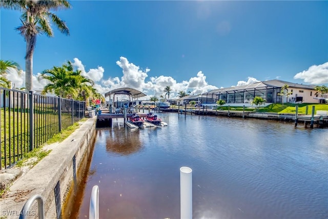 property view of water featuring a boat dock and fence