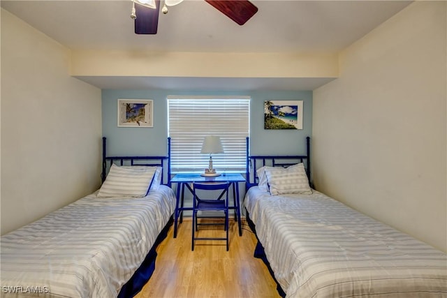 bedroom featuring ceiling fan and wood finished floors