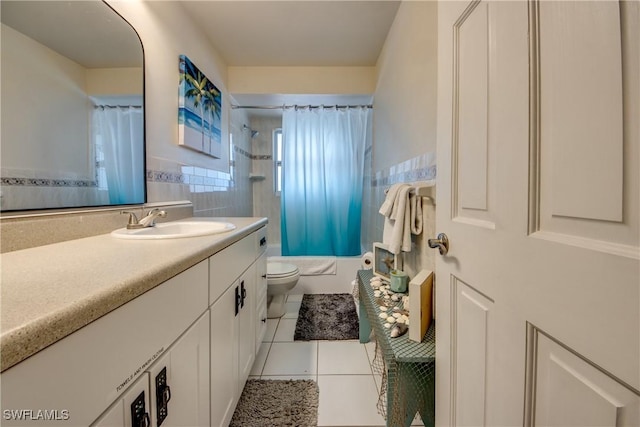 full bathroom featuring shower / bath combination with curtain, tile patterned flooring, vanity, and toilet