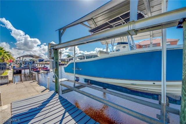 view of dock featuring a water view and boat lift