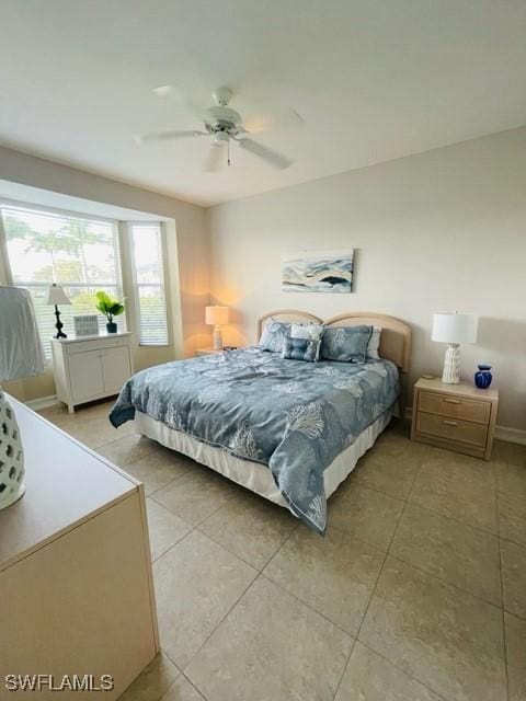 bedroom with light tile patterned floors and a ceiling fan