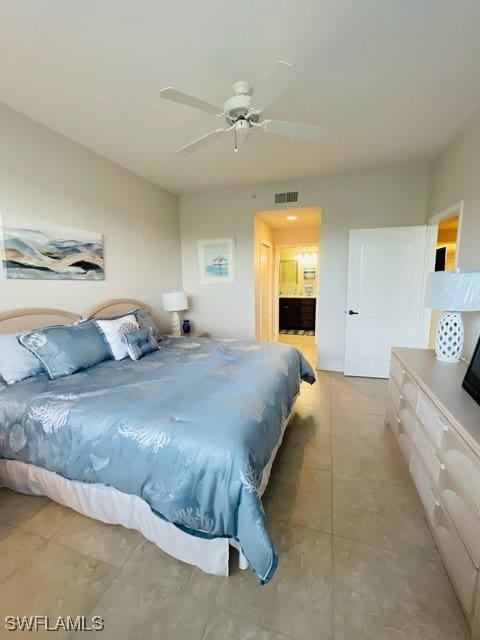 bedroom featuring light tile patterned floors, ceiling fan, connected bathroom, and visible vents