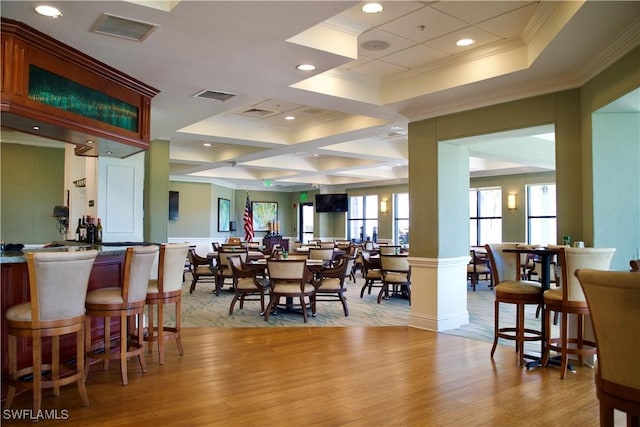 dining area featuring ornamental molding, recessed lighting, visible vents, and light wood-style floors