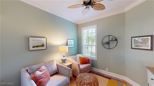 living area featuring ornamental molding, wood finished floors, a ceiling fan, and baseboards