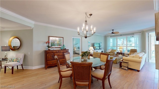 dining space featuring light wood-style flooring, ornamental molding, a chandelier, and baseboards