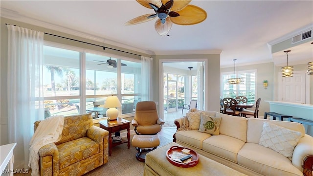 sunroom with visible vents and ceiling fan