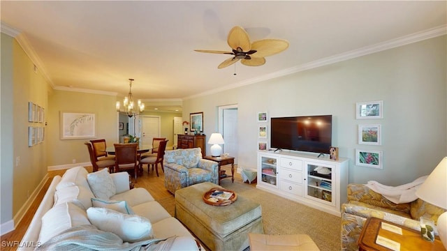 living room featuring wood finished floors, crown molding, baseboards, and ceiling fan with notable chandelier