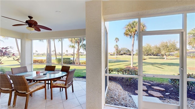 sunroom featuring ceiling fan