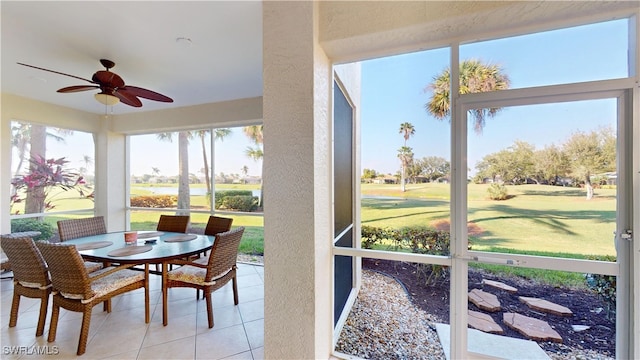 sunroom with a ceiling fan