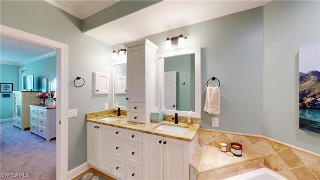 bathroom featuring ornamental molding, a sink, baseboards, and double vanity