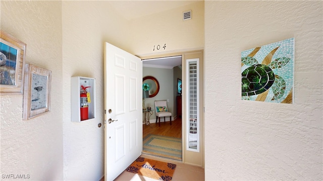 entrance to property featuring visible vents