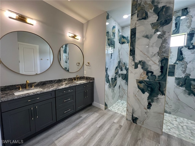 1104 Alaska Ave, Lehigh Acres, FL 33971 - bathroom with double vanity, wood finished floors, and a marble finish shower