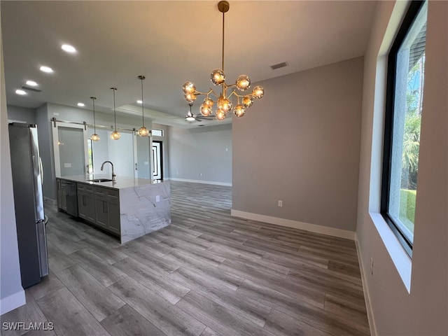 1104 Alaska Ave, Lehigh Acres, FL 33971 - kitchen with freestanding refrigerator, wood finished floors, open floor plan, recessed lighting, and dishwasher