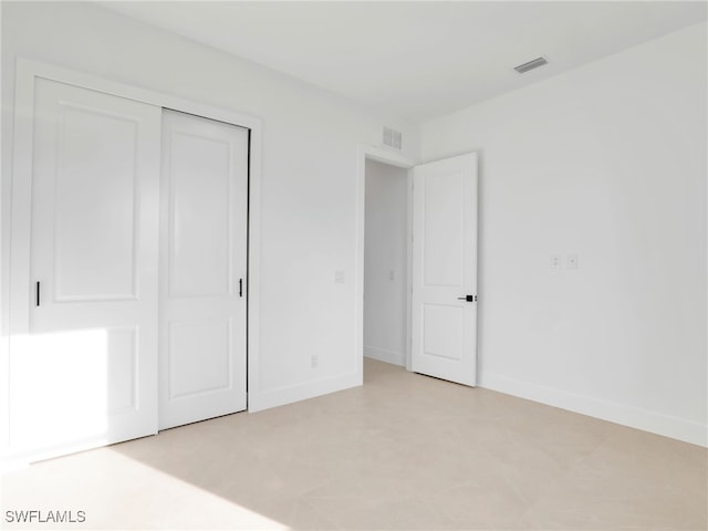 1612 NW 9th Ave, Cape Coral, FL 33993 - unfurnished bedroom featuring visible vents, a closet, and baseboards