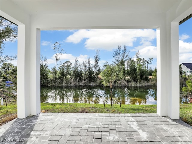 view of patio / terrace with a water view