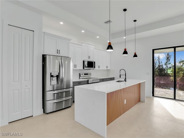1612 NW 9th Ave, Cape Coral, FL 33993 - kitchen featuring pendant lighting, white cabinets, a sink, appliances with stainless steel finishes, and recessed lighting