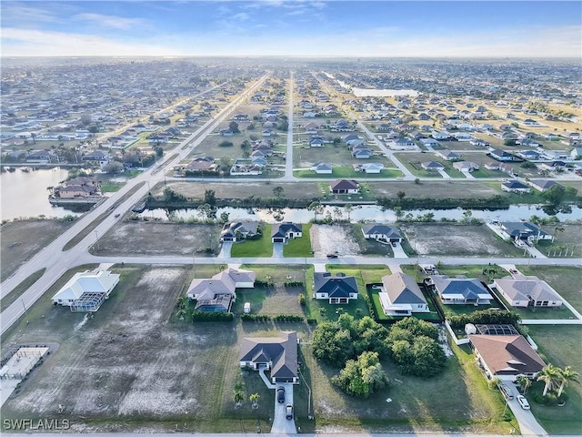 aerial view with a residential view and a water view