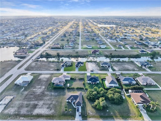 1612 NW 9th Ave, Cape Coral, FL 33993 - aerial view with a water view and a residential view