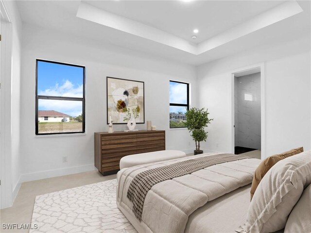 1612 NW 9th Ave, Cape Coral, FL 33993 - bedroom with recessed lighting, a tray ceiling, and baseboards