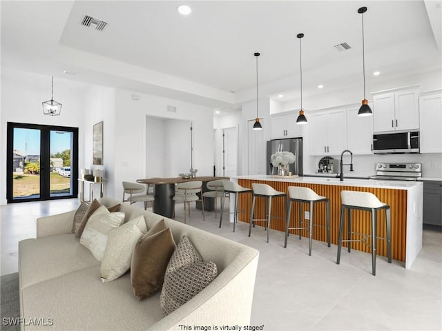 1612 NW 9th Ave, Cape Coral, FL 33993 - living room featuring visible vents and recessed lighting