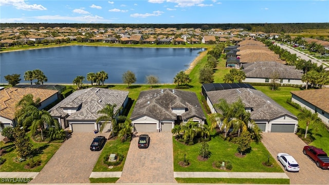 aerial view with a water view and a residential view