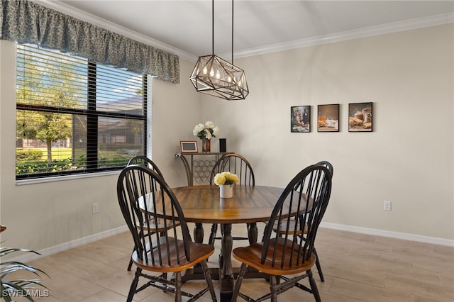 dining space featuring ornamental molding, plenty of natural light, and baseboards