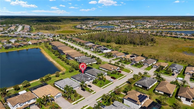 aerial view featuring a water view and a residential view