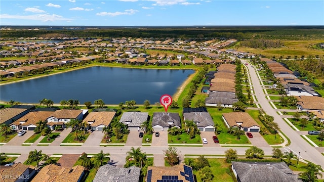 aerial view with a residential view and a water view