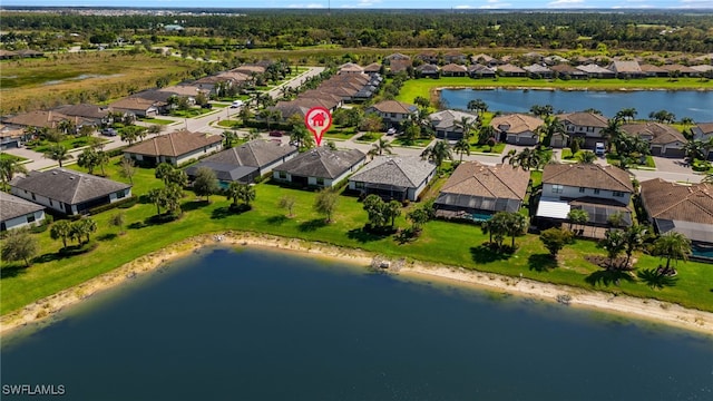 bird's eye view featuring a residential view and a water view