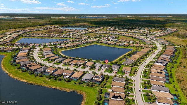 bird's eye view with a water view and a residential view