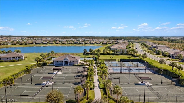 drone / aerial view with a residential view and a water view