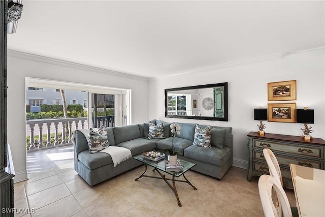 living room featuring light tile patterned floors, baseboards, and ornamental molding