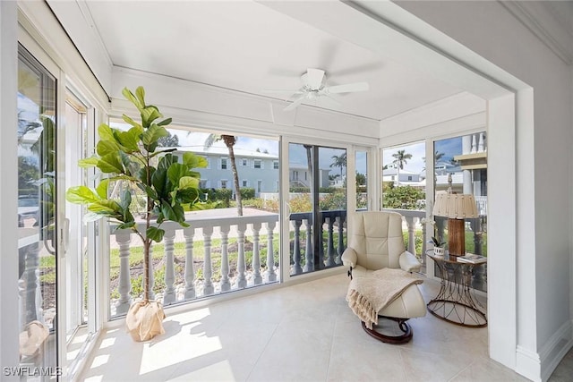 sunroom featuring ceiling fan