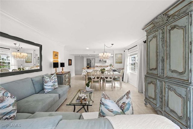 living area featuring a chandelier, light tile patterned flooring, and crown molding