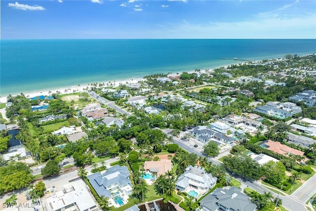 birds eye view of property with a water view and a residential view